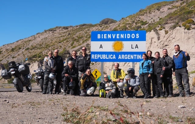 Customers in front of the welcome to Argentina sign.