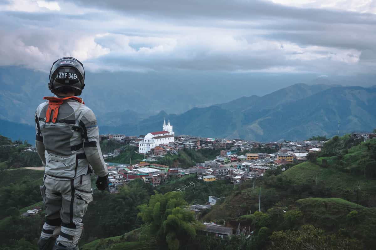 Ricardo at a viewpoint overlooking a mountainous town in Colombia.