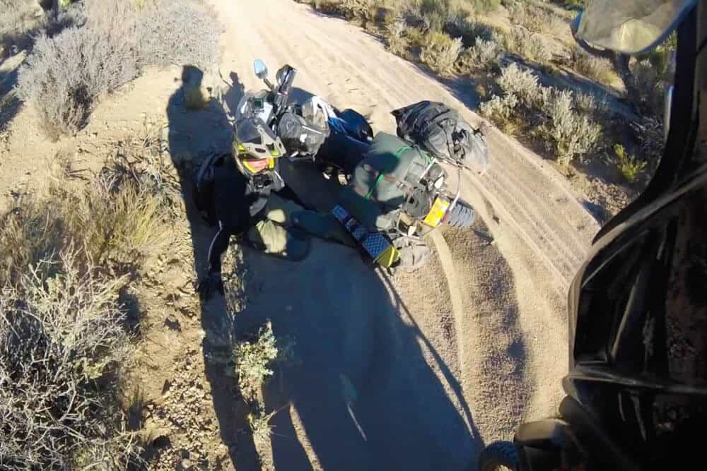 Garrett getting his foot wedge under the bike. He mentioned being well protected in his new Klim Adventure GTX boot.