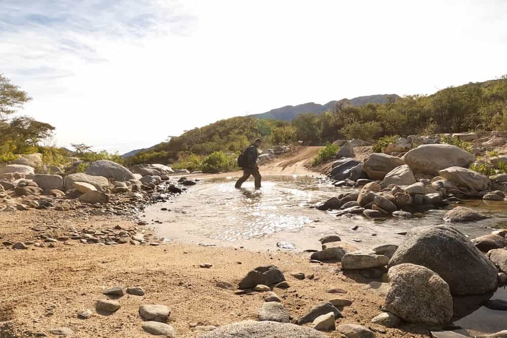 Garrett testing out both the walkability and gortex liner on the Klim Adventure GTX in a river in Baja.